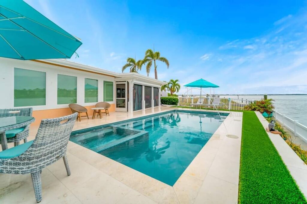 Custom swimming pool construction in backyard